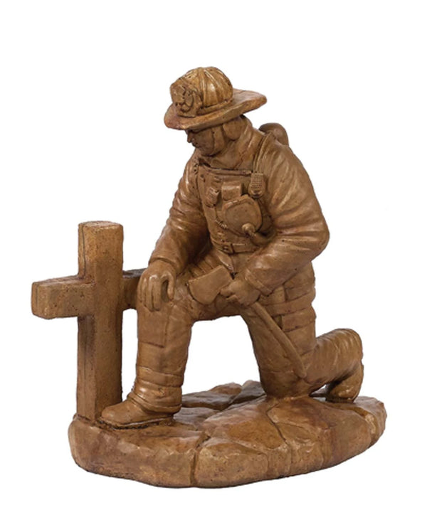 Statue - Kneeling fireman at Cross