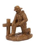 Statue - Kneeling fireman at Cross