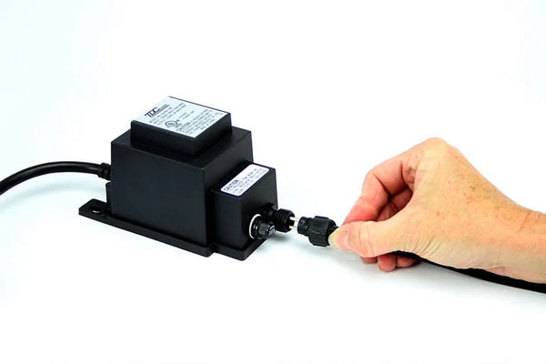 Connect the quick-connect fitting to an outdoor, 12-volt transformer (not included).